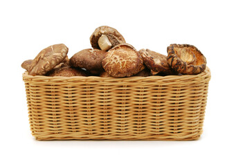 Dried mushrooms isolated in basket on a white background
