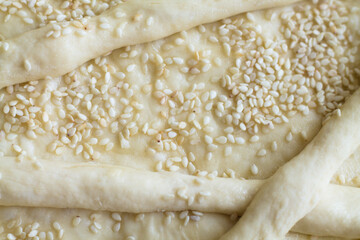 Baking texture with sesame seeds. Homemade baking.