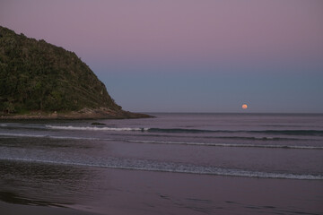 the full moon on the beach