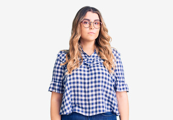 Young caucasian woman wearing casual clothes relaxed with serious expression on face. simple and natural looking at the camera.