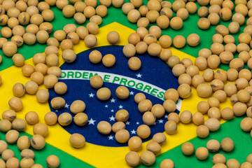 Flag of Brazil covered in soybeans. Concept of South America agricultural imports, exports, trade, trade war, tariffs, production and commodity markets