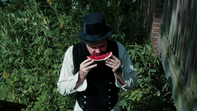 old timey eating watermellon