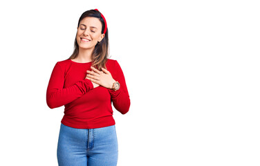 Obraz na płótnie Canvas Young beautiful woman wearing casual clothes smiling with hands on chest with closed eyes and grateful gesture on face. health concept.