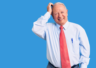 Senior handsome grey-haired man wearing elegant tie and shirt confuse and wonder about question. uncertain with doubt, thinking with hand on head. pensive concept.