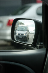 Obraz na płótnie Canvas rear view mirror of car driving in motion