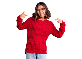 Young beautiful mixed race woman wearing red sweater and glasses looking confident with smile on...