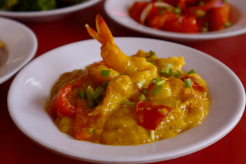 Freshly cooked buttered shrimp on a plate