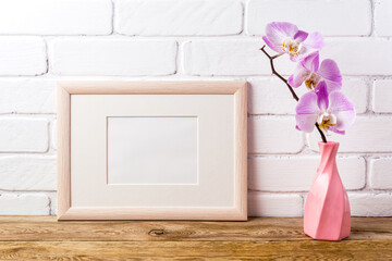 Wooden landscape frame mockup with pink orchid