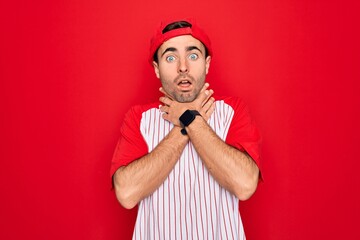 Young handsome sporty man with blue eyes wearing striped baseball t-shirt and cap shouting and suffocate because painful strangle. Health problem. Asphyxiate and suicide concept.