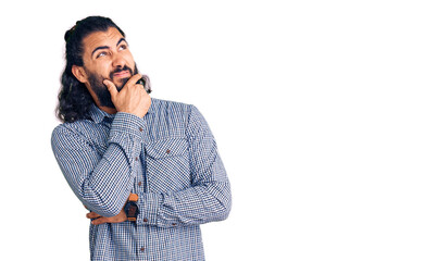 Young arab man wearing casual clothes thinking worried about a question, concerned and nervous with hand on chin
