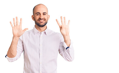 Naklejka premium Young handsome man wearing elegant shirt showing and pointing up with fingers number nine while smiling confident and happy.