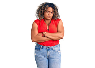 Young african american plus size woman wearing casual style with sleeveless shirt skeptic and nervous, disapproving expression on face with crossed arms. negative person.