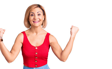 Young blonde woman wearing casual clothes screaming proud, celebrating victory and success very excited with raised arms