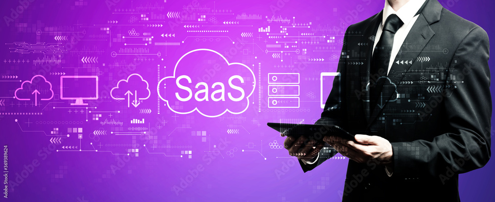 Aufkleber saas - software as a service concept with businessman using his tablet computer