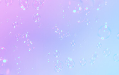 Beautiful gradient colors purple, blue background with soap bubbles float in the air.