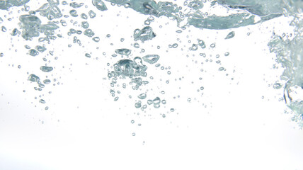 Water splash with air bubbles float on a white background.