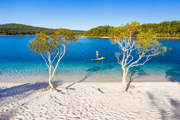 Stand up paddle boarding  on Lake Mckenzie, Fraser Island