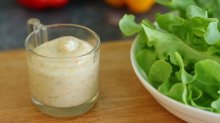 Salad dressing on the Wooden tray with