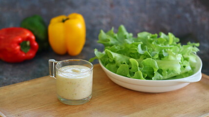 Salad dressing on the Wooden tray with