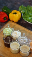 Salad dressing on the Wooden tray with