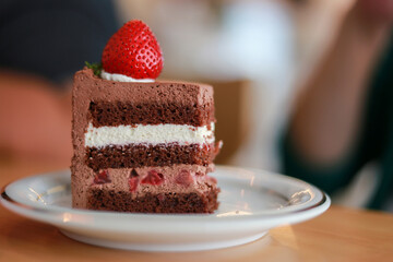 Cream Chocolate Layer Cake Sprinkle with red strawberries Focus point selection