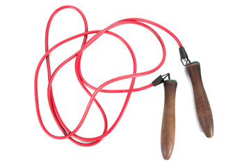 Old skipping rope with wood handle isolated on white background. Vintage old jump rope with red...