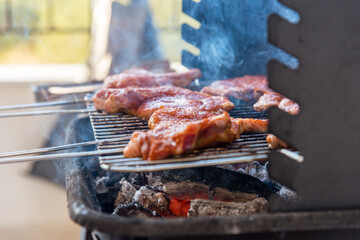 BBQ ribs. Ribs fried over an open fire. Fire and smoke roll meat.