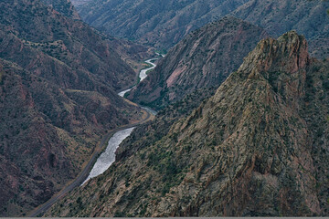 Fototapeta na wymiar Arkansas river in Royal gorge in colorado. River runs through rocky ravine in the largest gorge in the US. Canyon in canon city