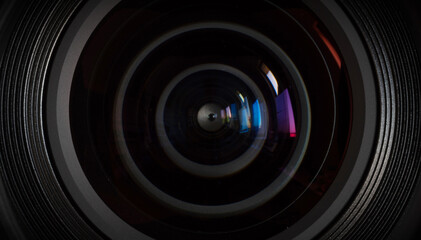 Close-up camera lens with color reflections - obrazy, fototapety, plakaty