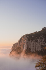 sunrise on a mountain above the clouds