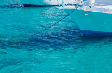 bow of a white yacht on background of sea water