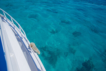 bow of a white yacht on background of sea water