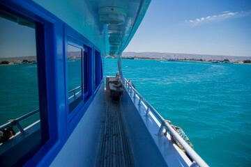 Fototapeta na wymiar deck of yacht on azure sea water