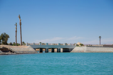 sea beach with palms and houses in egypt