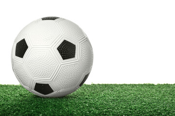 Fototapeta na wymiar Soccer ball on green field against white background