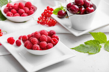 Tasty fresh berries on white background