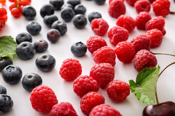 Tasty fresh berries on white background