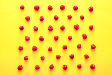 Tasty ripe raspberries on color background