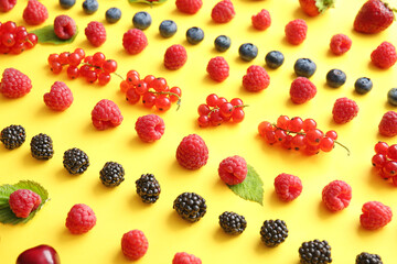 Tasty fresh berries on color background