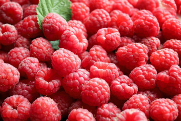Tasty ripe raspberries as background