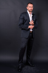 Obraz premium Portrait of handsome bearded businessman in suit