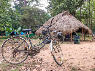 Old bicycle parked inside the Angkor wat
