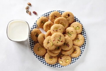 Milk peda is a traditional Indian sweet made from milk or khoya and garnished with pistachio to celebrate festivals like Diwali.