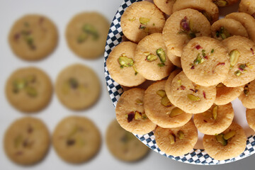 Milk peda is a traditional Indian sweet made from milk or khoya and garnished with pistachio to...