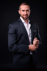 Portrait of handsome bearded businessman in suit