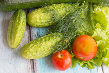 Fresh vegetables on the table cucumbers tomatoes