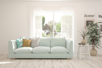 White stylish minimalist room with sofa and summer landscape in window. Scandinavian interior design. 3D illustration