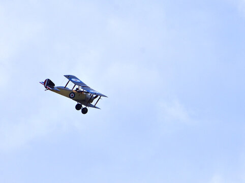  Vintage 1916 Sopwith Pup Aircraft in flight .
