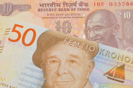 A macro image of a orange ten rupee bill from India paired up with a gray and orange fifty kronor note from Sweden.  Shot close up in macro.