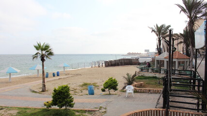 Landscape of sea with umbrellas and chairs